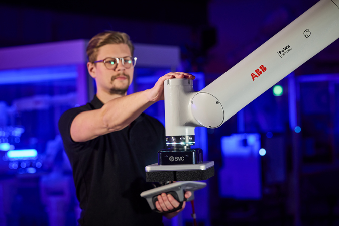 person interacting with PoWa cobot